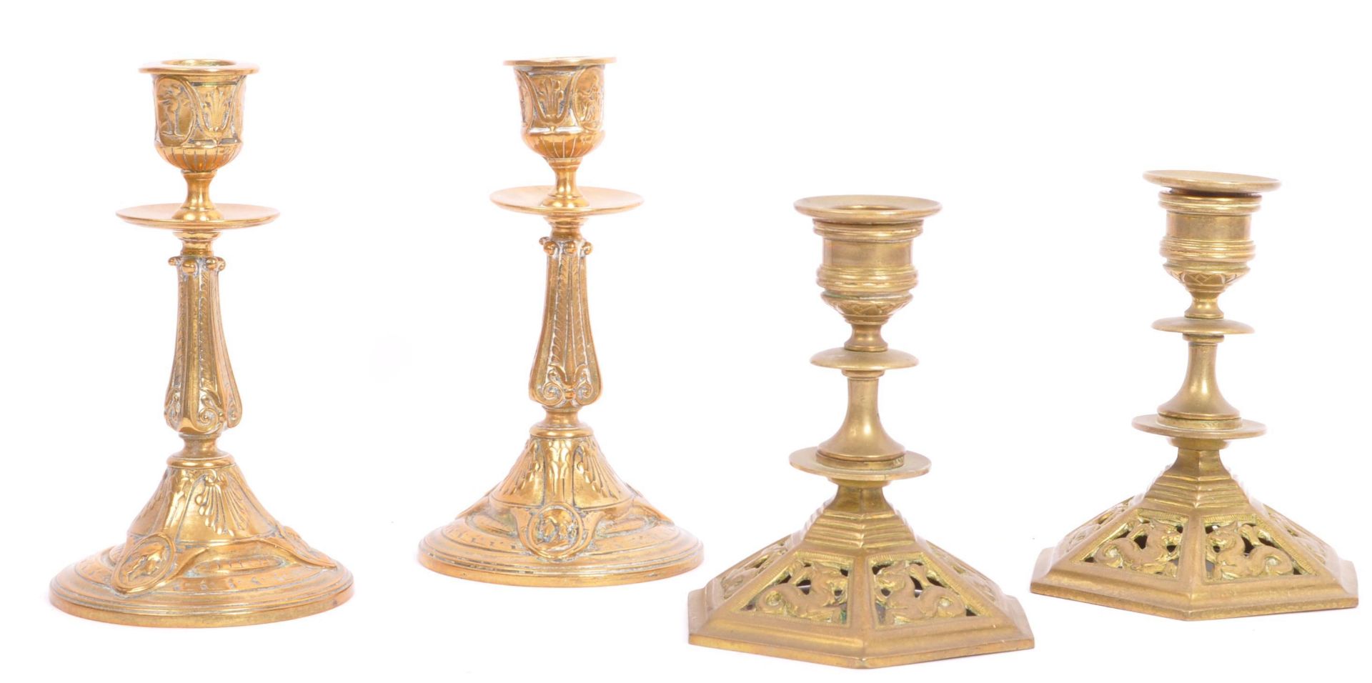 TWO PAIRS OF EARLY 20TH CENTURY BRASS CANDLESTICK HOLDERS