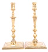 PAIR OF GEORGE III EARLY 19TH CENTURY BRASS CANDLE HOLDERS