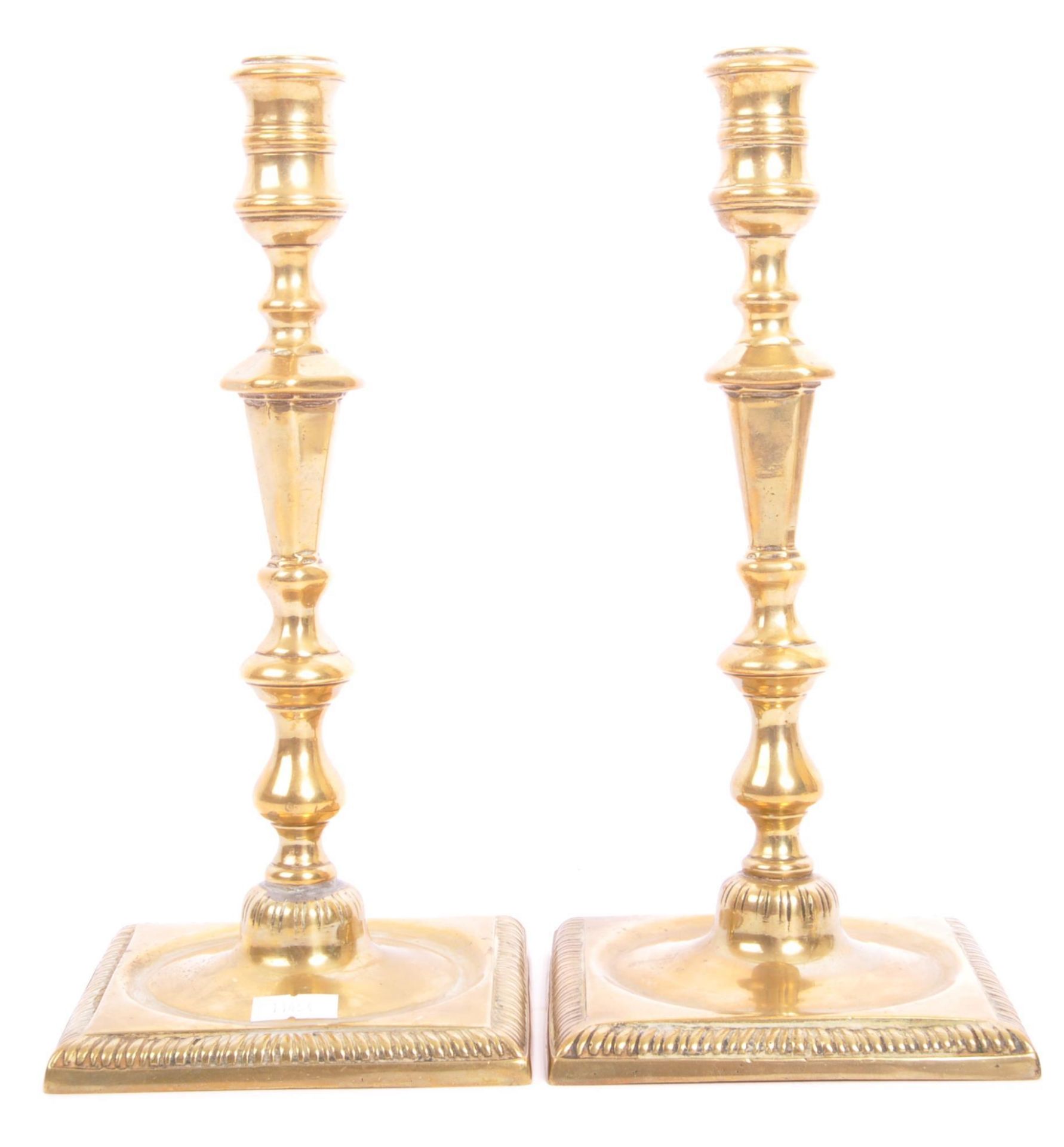 PAIR OF GEORGE III EARLY 19TH CENTURY BRASS CANDLE HOLDERS