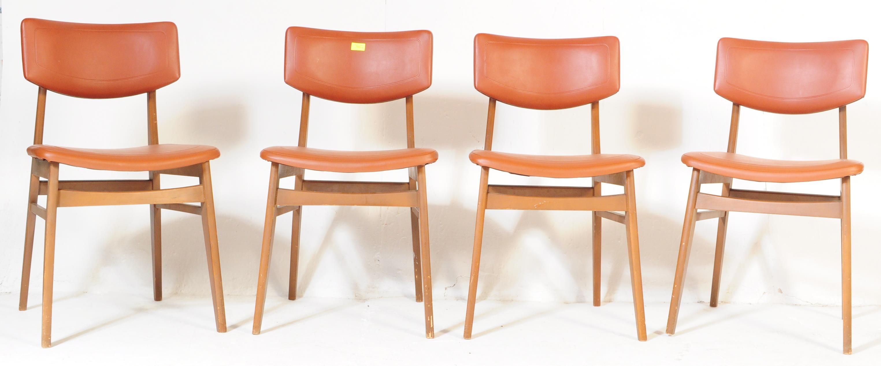 FOUR MID CENTURY TEAK & LEATHERETTE DINING CHAIRS