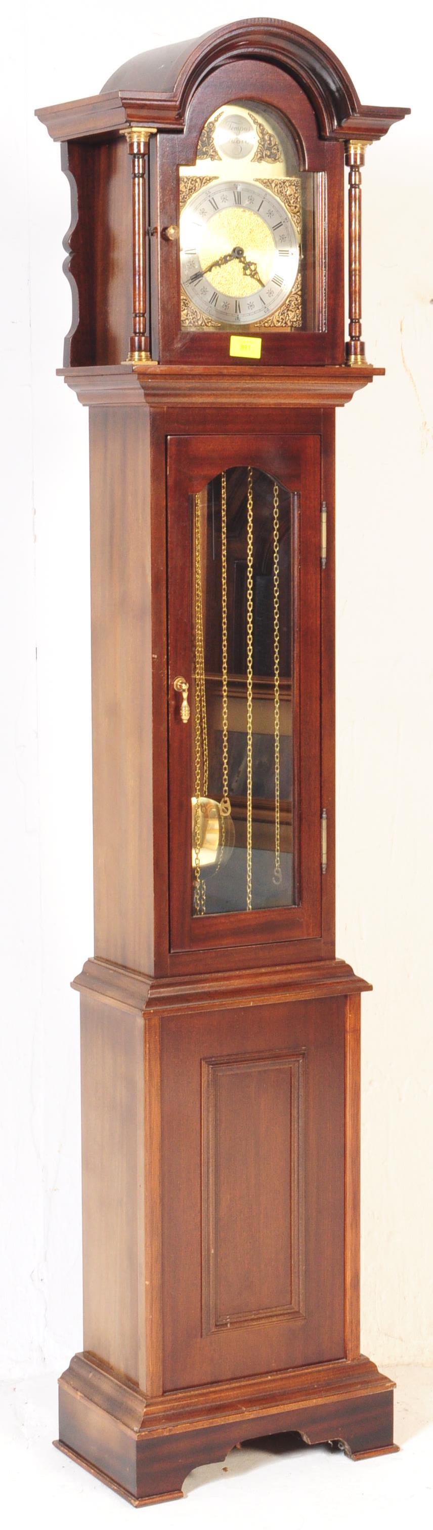 A MAHOGANY TEMPUS FUGIT LONGCASE GRANDMOTHER CLOCK