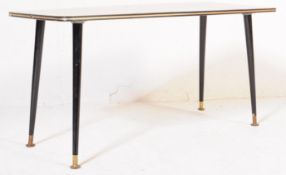 A RETRO VINTAGE FORMICA TOPPED COFFEE TABLE W/ DANSETTE LEGS
