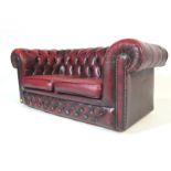 EARLY 20TH CENTURY OX BLOOD LEATHER CHESTERFIELD SOFA