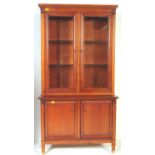 A VICTORIAN STYLE MAHOGANY DRESSER CABINET BOOKCASE