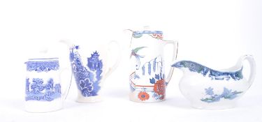 FOUR 20TH CENTURY RETRO BLUE AND WHITE WILLOW PATTERN JUGS