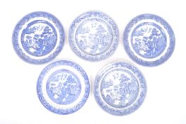 FIVE BLUE AND WHITE WILLOW PATTERN CHINOISERIE PLATES