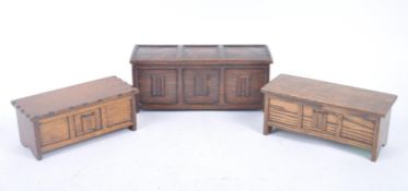 THREE EARLY 20TH CENTURY WOODEN BOXES SHAPED AS COFFERS