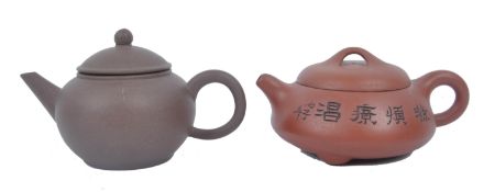 TWO EARLY 20TH CENTURY CHINESE YIXING POTTERY TEAPOTS