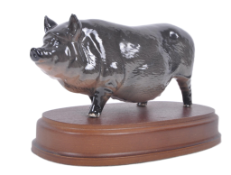 EARLY 20TH CENTURY STAFFORDSHIRE BLACK PIG ON WOODEN STAND
