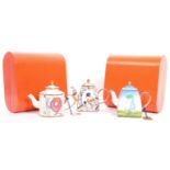 THREE CHARLOTTE DI VITA ENAMELLED MINIATURE TEAPOTS