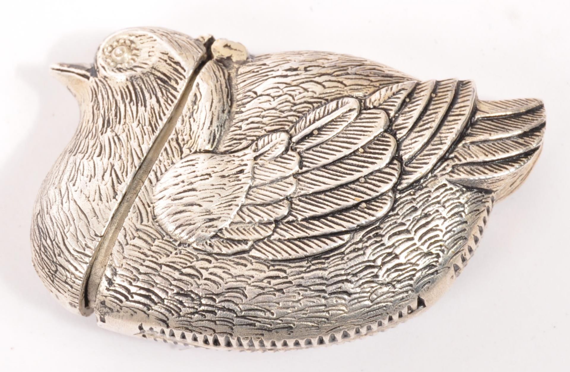 A CONTEMPORARY WHITE METAL BIRD DESIGN VESTA MATCH CASE