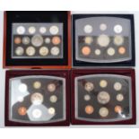 COLLECTION OF FOUR CASED PROOF COIN SETS