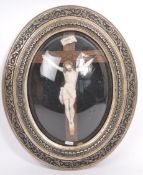 20TH CENTURY CATHOLIC STUCCO CRUCIFIX IN DOMED FRAME