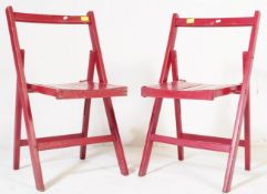 A PAIR OF 20TH CENTURY FOLDING DINING CHAIRS IN RED