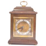 A VINTAGE 20TH CENTURY OAK CASED MANTLE CLOCK BY GARRARD & CO