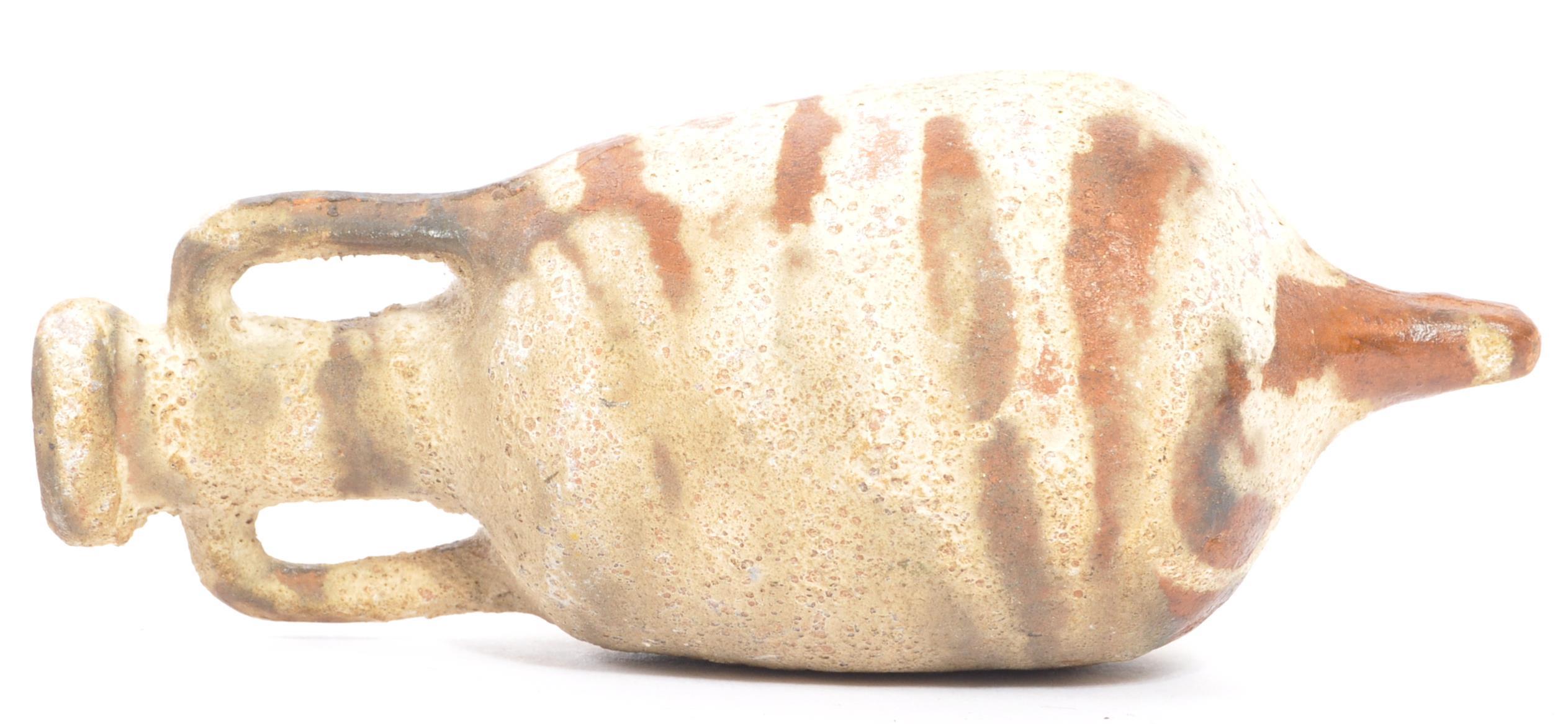 A miniature reproduction Roman terracotta amphora wine vessel having