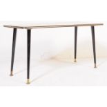 A RETRO VINTAGE FORMICA TOPPED COFFEE TABLE W/ DANSETTE LEGS