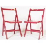 A PAIR OF 20TH CENTURY FOLDING DINING CHAIRS IN RED