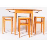 A RETRO MID 20TH CENTURY FORMICA KITCHEN TABLE WITH STOOLS