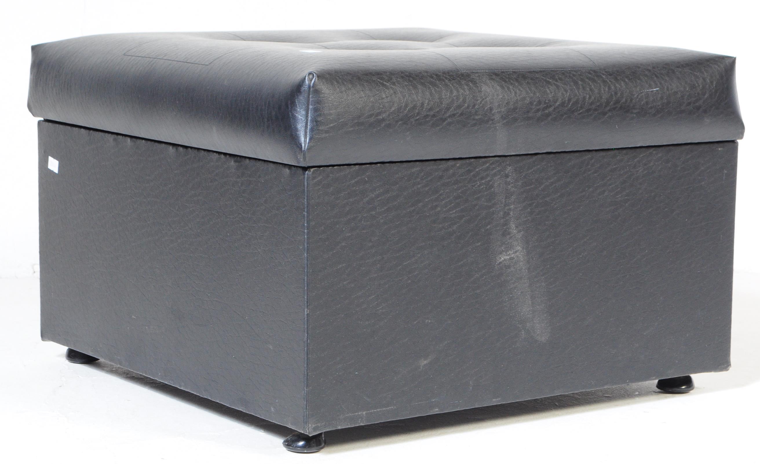 A VINTAGE RETRO SQUARE BLACK VINYL FOOT STOOL POUF