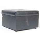 A VINTAGE RETRO SQUARE BLACK VINYL FOOT STOOL POUF