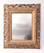 19TH CENTURY ROCOCO STYLE GILT WOOD SCROLL LEAF MIRROR