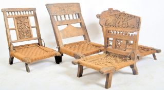 FOUR EARLY 20TH CENTURY WOODEN INDIAN PIDA RAJASTHANI CHAIRS
