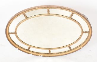 19TH CENTURY VICTORIAN OVAL GILTWOOD AND GESSO MIRROR