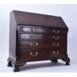 MINIATURE GEORGE III STYLE MAHOGANY BUREAU