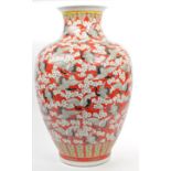 LARGE CHINESE VASE IN RED EMBELLISHED WITH CRANES & BLOSSOM