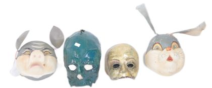 FOUR MID CENTURY VINTAGE PAPIER MACHE THEATRICAL MASKS