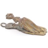 A VICTORIAN BRASS LETTER CLIP BY MERRY PHIPSON AND PARKERS