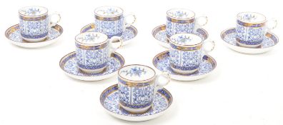 SEVEN EARLY 20TH CENTURY 'ROYAL LILLY' PATTERN CUPS & SAUCERS