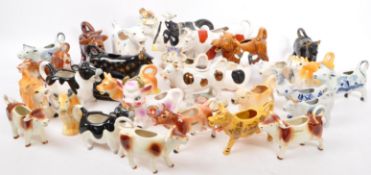 COLLECTION OF CERAMIC CREAM MILK POURING COW JUGS