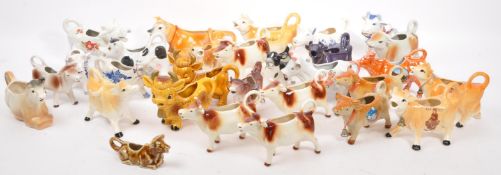 COLLECTION OF CERAMIC CREAM MILK POURING COW JUGS