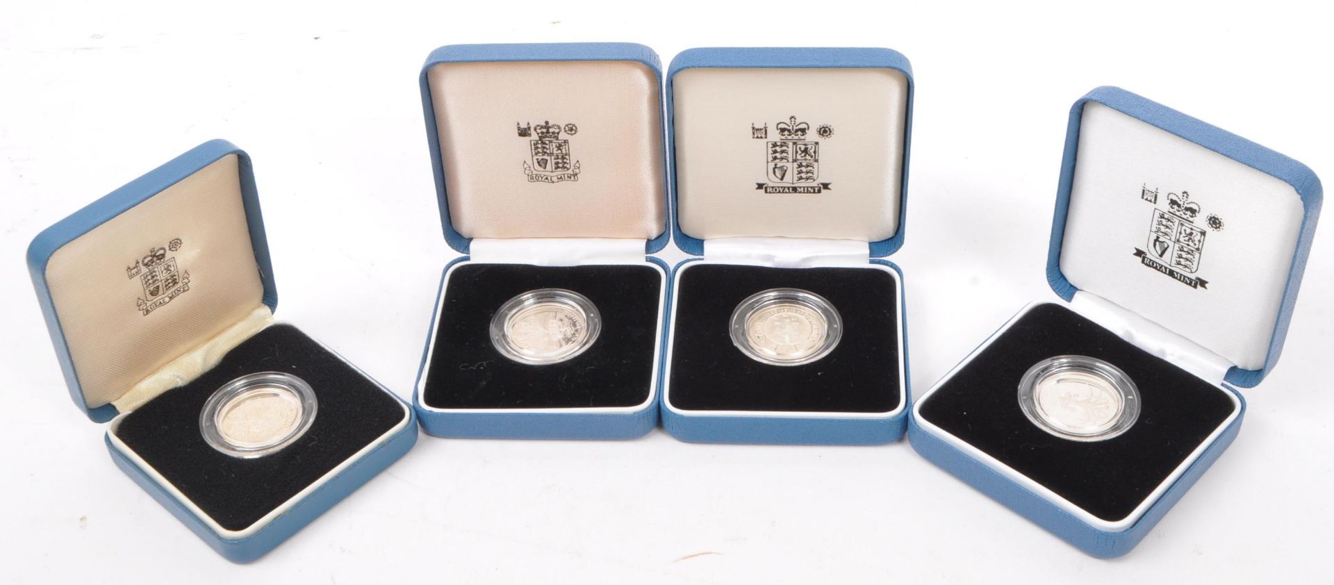 SET OF FOUR ROYAL MINT SILVER PROOF ONE POUND / £1 COINS