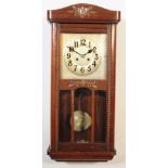 20TH CENTURY WALL MOUNTED OAK CASED PENDULUM CLOCK