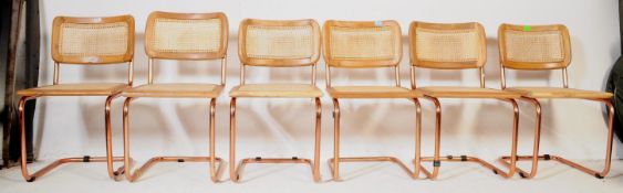 FOUR VINTAGE RATTAN & ROSE GOLD CHROME CANTILEVER CHAIRS