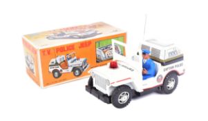 TINPLATE TOYS - VINTAGE JAPANESE TINPLATE BATTERY OPERATED POLICE JEEP