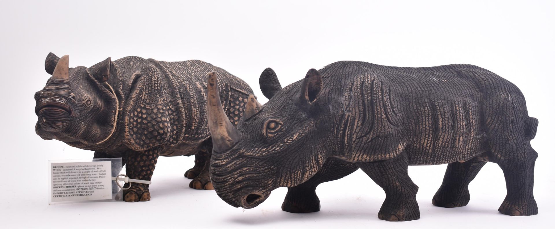 PAIR OF CONTEMPORARY RHINO CARVED SCULPTURES