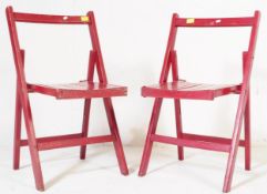 A PAIR OF 20TH CENTURY FOLDING DINING CHAIRS IN RED