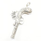 WHITE METAL WHISTLE PENDANT IN THE FORM OF A PISTOL