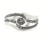 14CT WHITE GOLD BLUE & WHITE STONE CROSSOVER RING