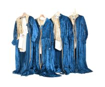 COLLECTION OF FOUR MATCHED REGENCY BLUE COSTUME DRESSES