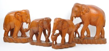 COLLECTION FOUR CARVED FRUITWOOD ELEPHANT FIGURES