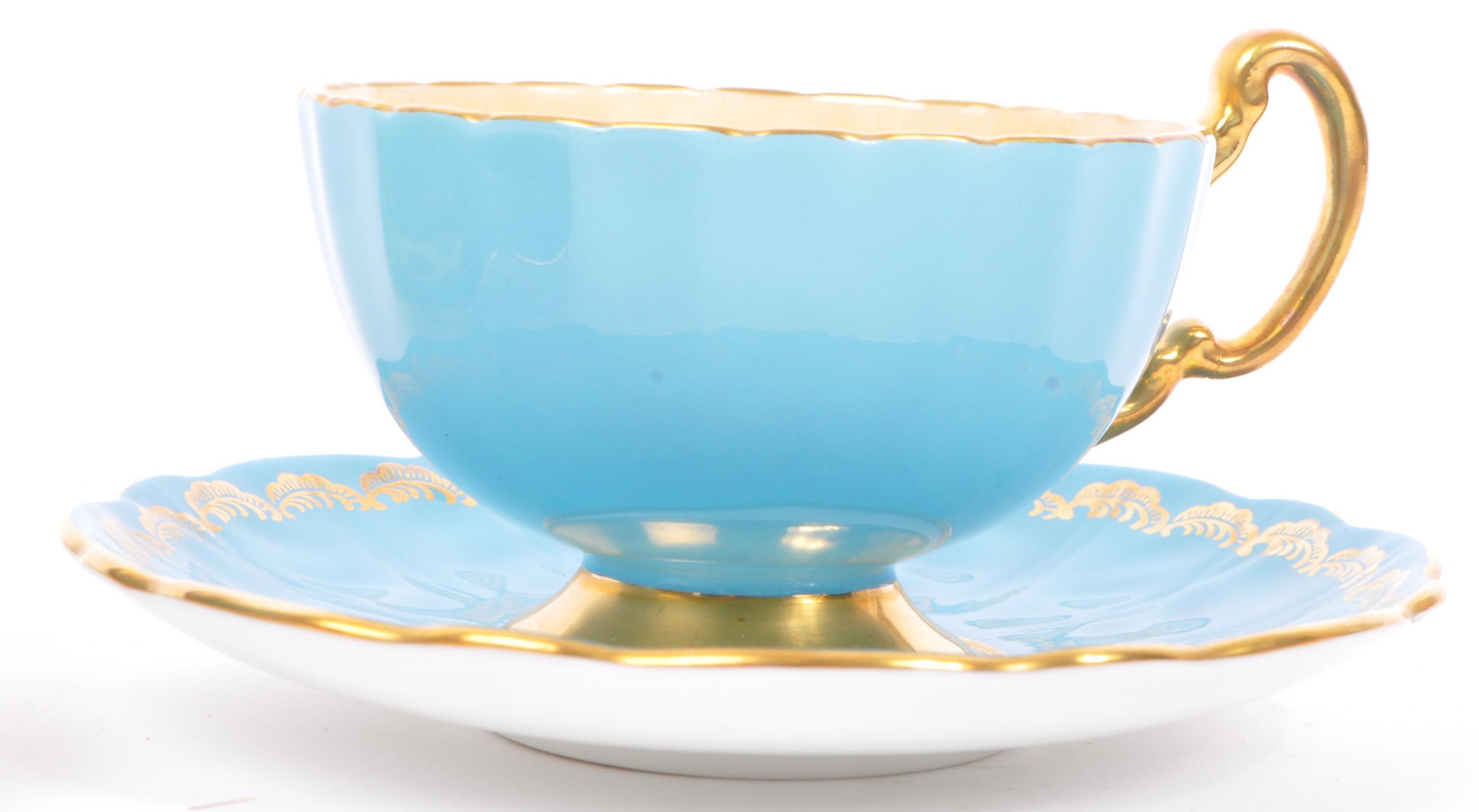 THREE PIECES AYNSLEY ORCHARD GOLD TEACUP & SAUCER - Image 6 of 7