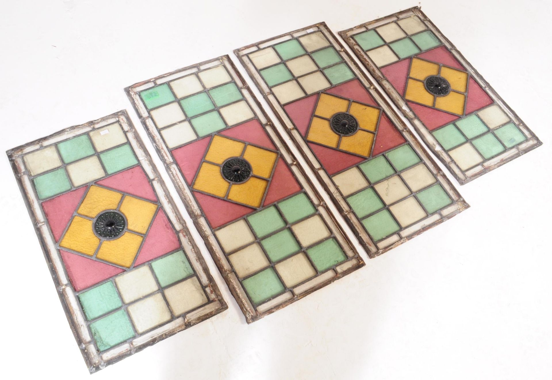 COLLECTION OF FOUR LEADED STAINED GLASS WINDOW PANELS