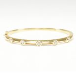 18CT GOLD & DIAMOND BANGLE BRACELET