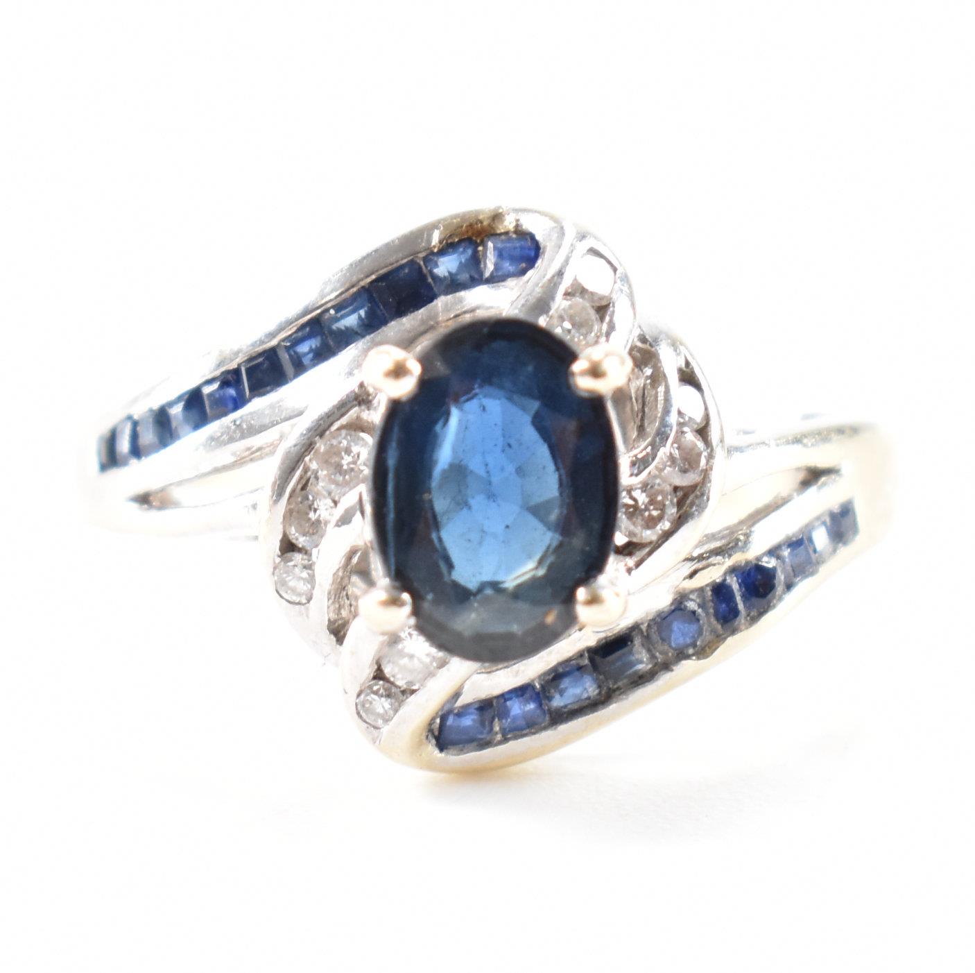 WHITE GOLD SAPPHIRE & DIAMOND CROSSOVER RING - Image 2 of 11
