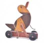 20TH CENTURY PAINTED WOODEN TOY DUCK ON WHEELS